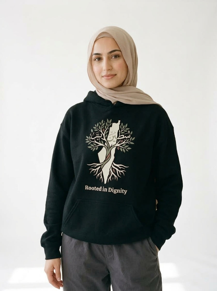 Rooted in Dignity Palestine Hoodie — the same olive tree design on a black hoodie